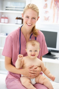 pediatrician holding a baby